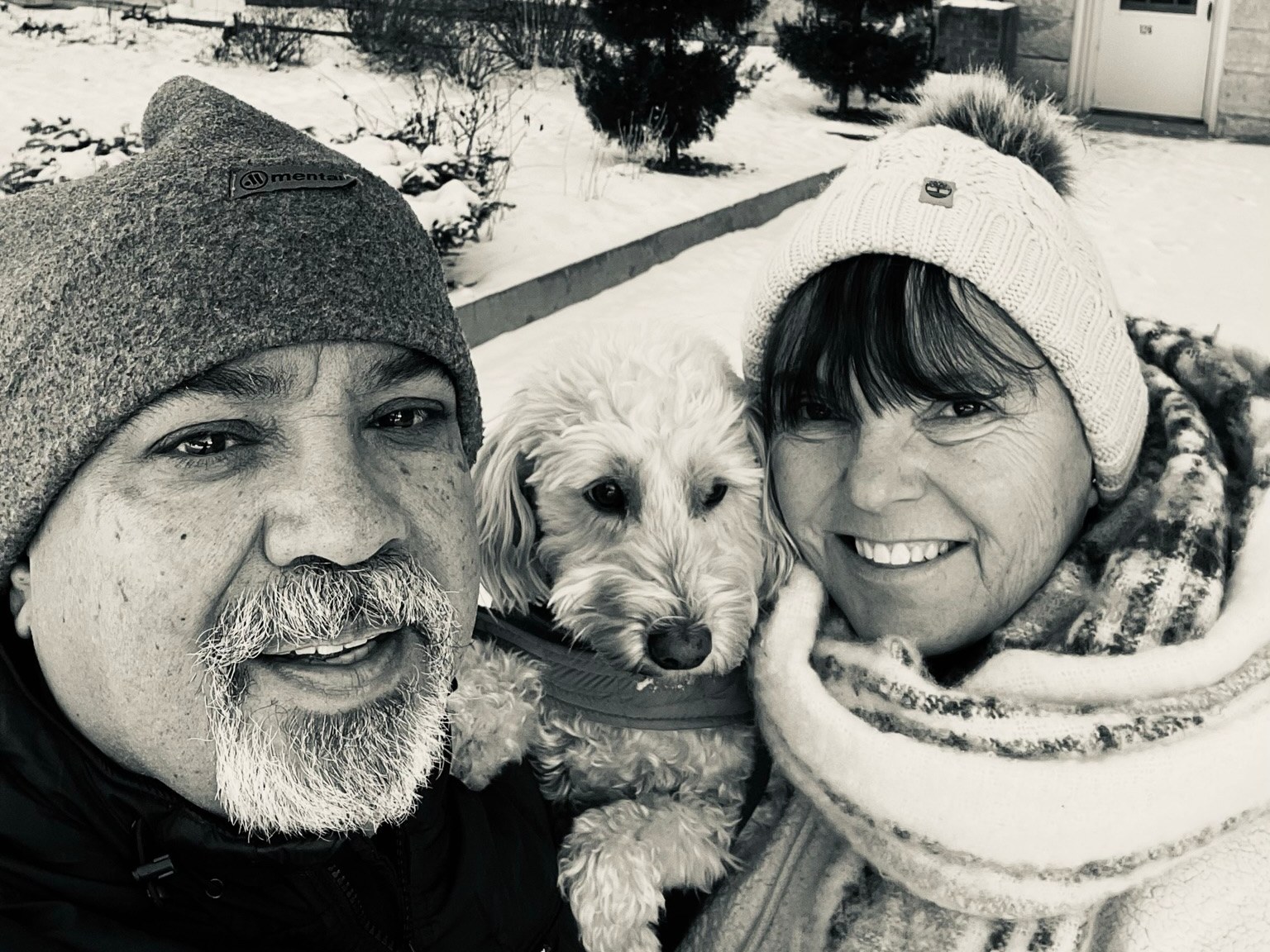 Your hosts, Nancy and her husband, with their dog on a snowy day in Elkader
