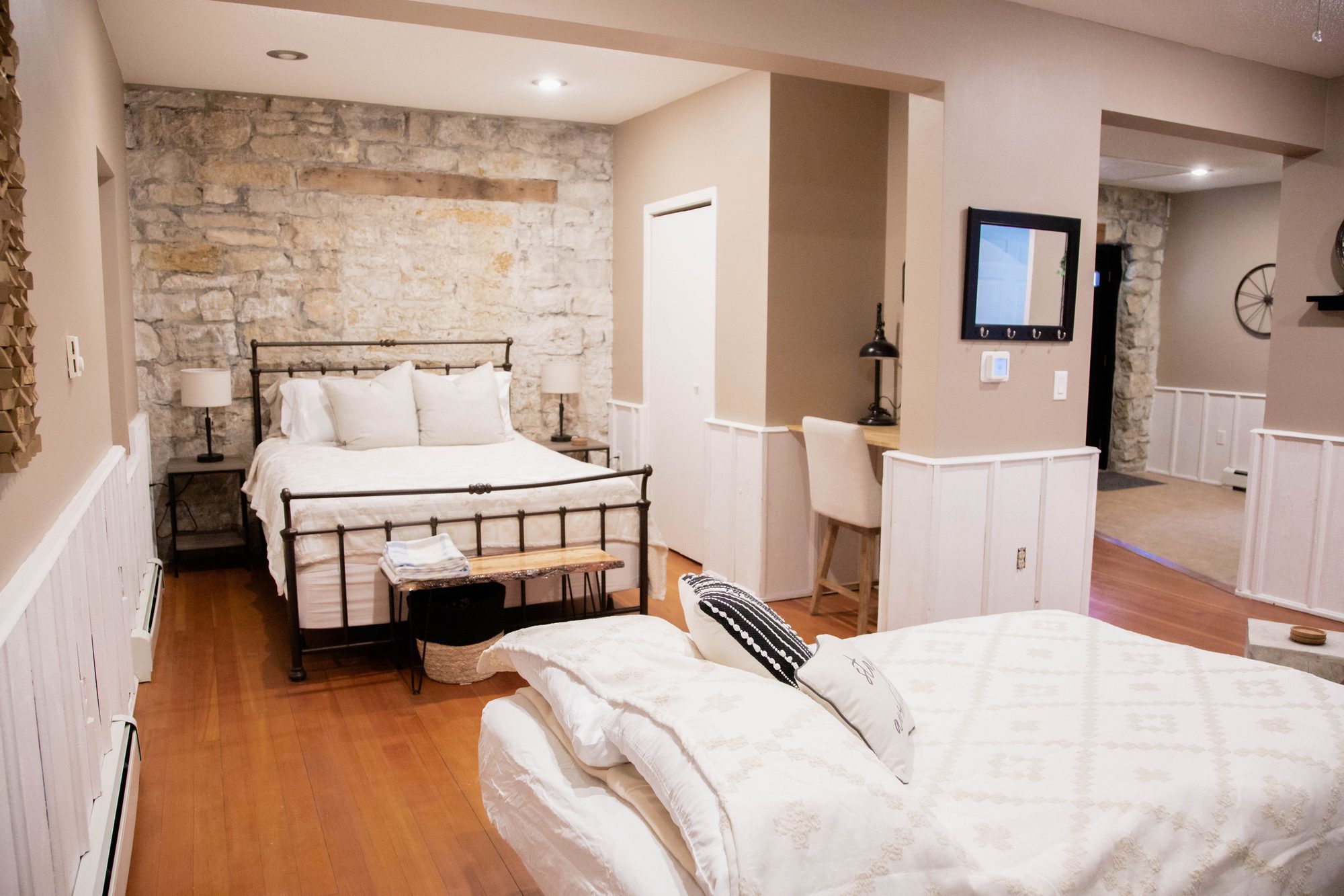 Suite B studio with the original 1840s limestone wall